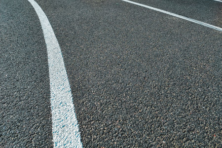 Bicycle treadmill, with white dividing strips, asphalt texture. The concept of the competition.の写真素材