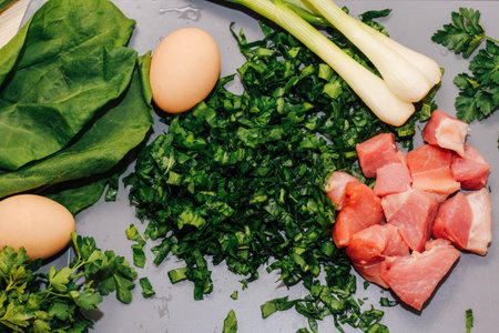 Young green chopped greens close-up, sour sorrel, eggs, meat and onions.の写真素材