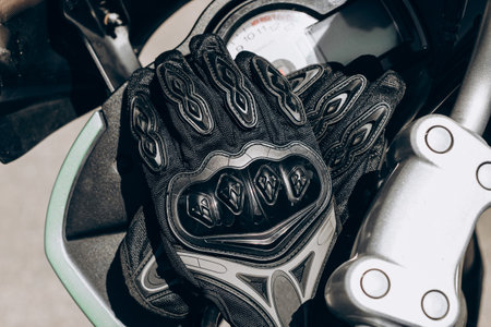 Black protective gloves for a motobiker with plastic inserts.の写真素材