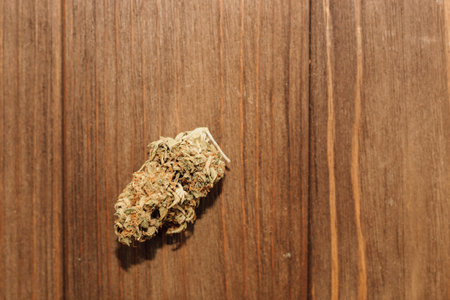 Medical marijuana, inflorescences of shinki weed plant on wooden background.の写真素材