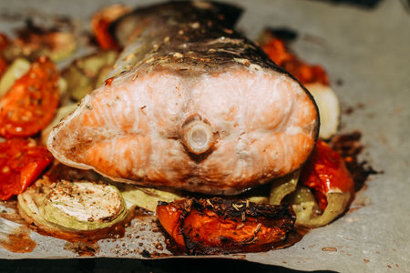 Red fish trout salmon baked in the oven with vegetables.の写真素材