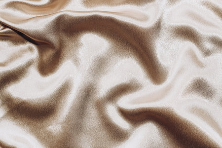 Beige silk fabric texture, Satin fashion Background for content.の写真素材
