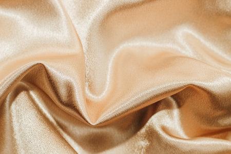 Gold silk fabric texture, Satin fashion Background for contentの写真素材