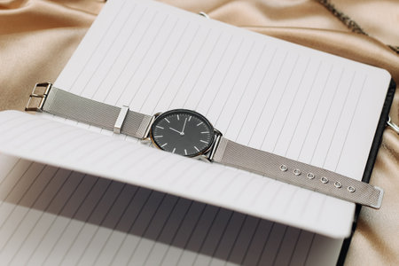 Clock and work notepad, business and time management concept.の写真素材