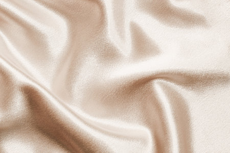 Beige silk fabric texture, Satin fashion Background for content.の写真素材