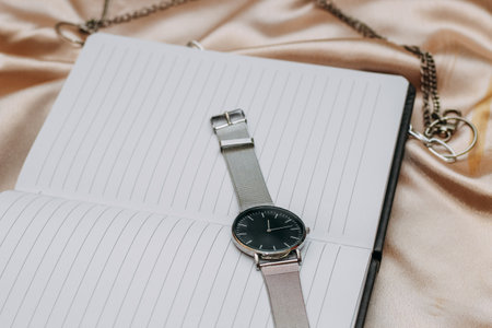 Clock and work notepad, business and time management concept.の写真素材