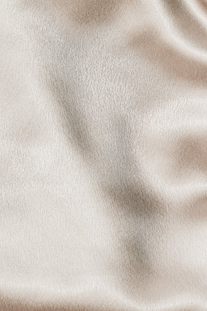 Beige silk fabric texture, Satin fashion Background for content.の写真素材