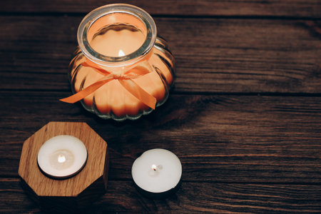Multicolored candles, paraffin, wax and aromatic on a wooden table.の写真素材