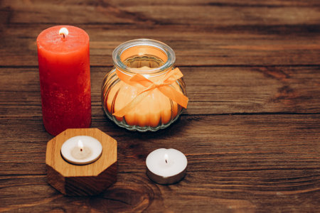 Multicolored candles, paraffin, wax and aromatic on a wooden table.の写真素材