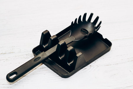 Kitchen tools plastic for multicooker on a wooden table in a dish organizer.の写真素材