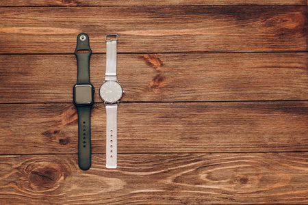Black technological smart watches and ordinary mechanical watches with a dial.の写真素材