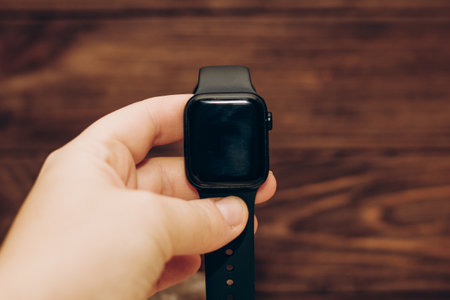 Black technological smart watch in hand.の写真素材