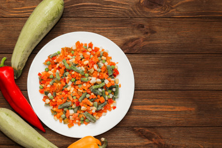 Frozen vegetables carrots, peas, beans in a plate.の写真素材