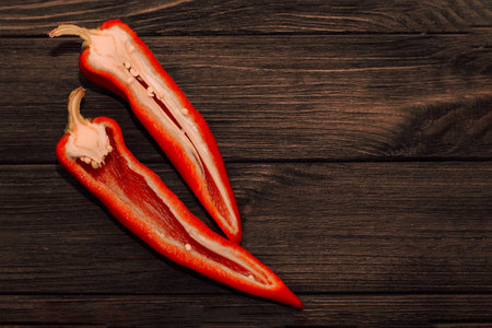 Red capi pepper on a wooden background, space for text.の写真素材