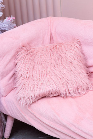 Decorative pillows on the bed in the bedroom as decoration of the interior and decor.の写真素材