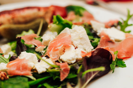 Salad with feta cheese with arugula and fried sausage.の写真素材