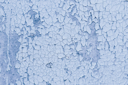 Blue texture of old cracked paint, grunge background.の写真素材