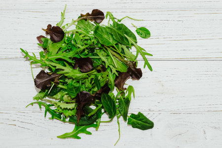Mix of lettuce leaves different types on the table.の写真素材