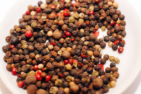 A mixture of peppers: black, red, allspice close-up.の写真素材