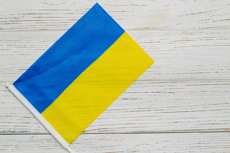 Ukrainian blue yellow flag on a wooden white background.の写真素材