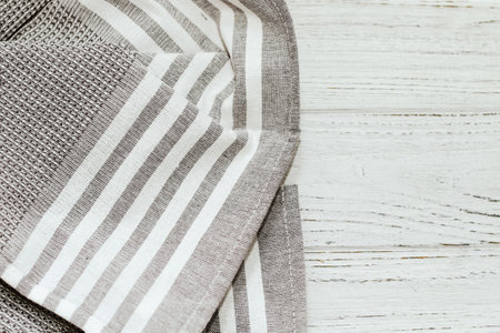 Kitchen modern textile towel on kitchen wooden table.の写真素材