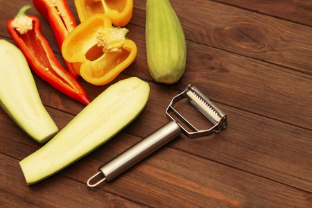Chopped vegetables, carrots, peppers, zucchini on a vegetable peeler.の写真素材