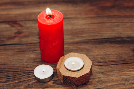 Multicolored candles, paraffin, wax and aromatic on a wooden table.の写真素材