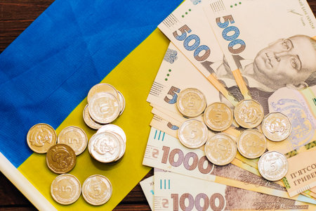 On the table with Ukrainian hryvnias, bills and coins.の写真素材