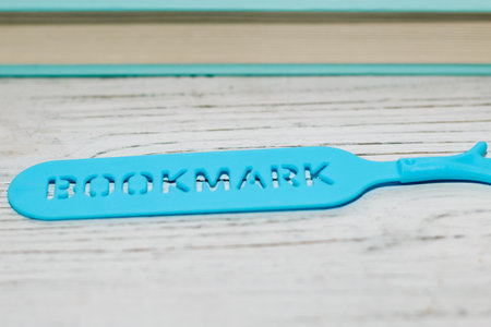 Blue stationery bookmark in the shape of a palm.の写真素材