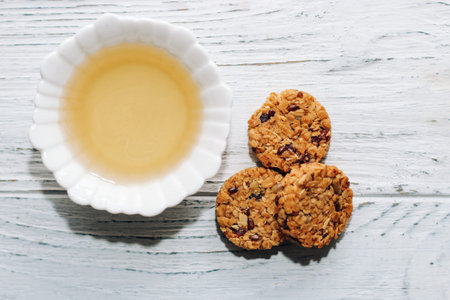 Healthy breakfast oat round granola with honey in a plate.