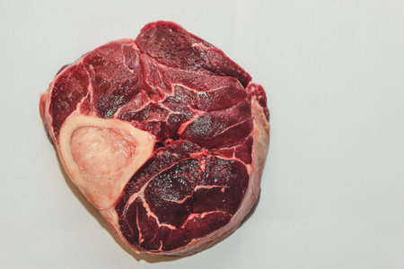 Fresh piece of meat big beef steak on the bone ossobuco.の写真素材
