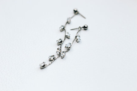 Silver ornaments made of white metal on a light background.の写真素材