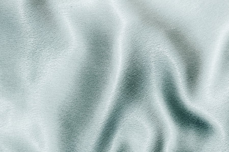 Blue shiny texture of silk satin satin with folds.の写真素材