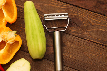 Chopped vegetables, carrots, peppers, zucchini on a vegetable peeler.の写真素材