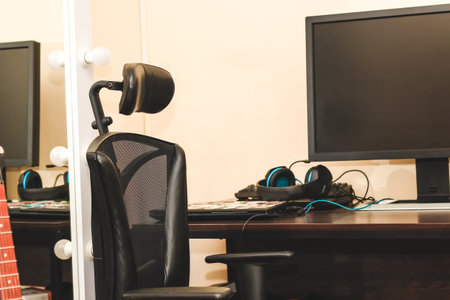 Gaming headphones with a microphone, an armchair, a gamer's place.の写真素材