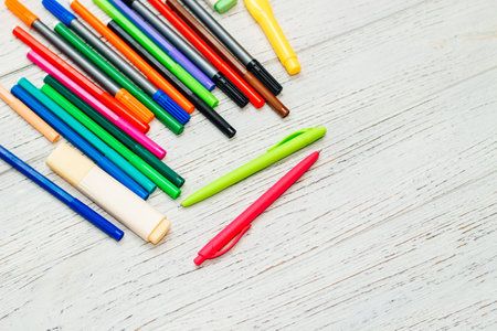 Stationery, colored felt-tip pens on a white table.の写真素材
