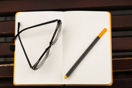Glasses for vision on a notepad with a marker, study concept.の写真素材