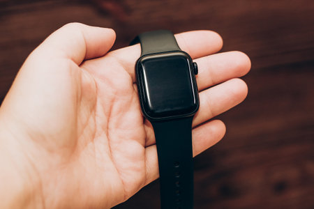 Black technological smart watch in hand.の写真素材
