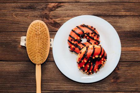 Massage wooden brush for dry massage against cellulite and donuts.の写真素材