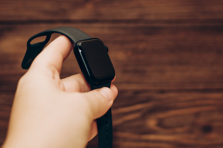 Black technological smart watch in hand.の写真素材