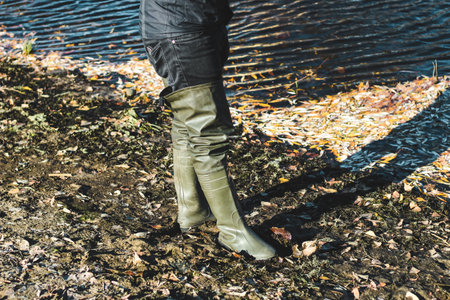 Rubber high boots at the fisherman for fishing.の写真素材