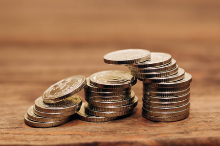 Ukrainian hryvnias coins in a stack on the table.
