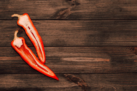 Red capi pepper on a wooden background, space for text.の写真素材
