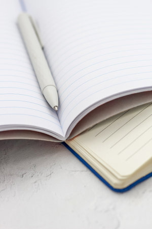 The pen lies in the notebook, the concept of study, time management.の写真素材