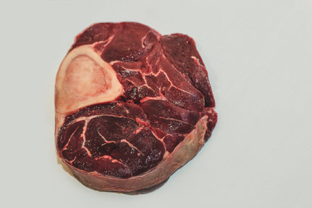 Fresh piece of meat big beef steak on the bone ossobuco.の写真素材