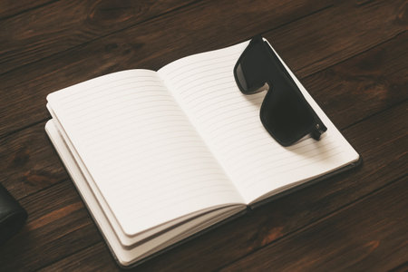 Notepad, diary, study concept, time management, with sunglasses.の写真素材