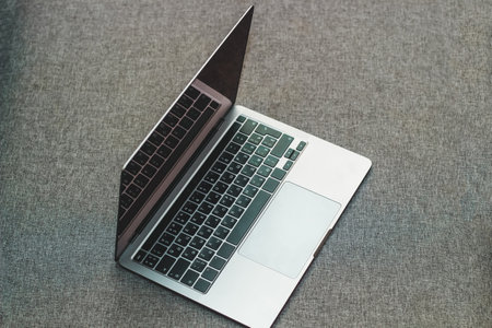 Laptop series flat metal on the table.の写真素材