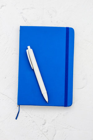 The pen lies in the notebook, the concept of study, time management.の写真素材