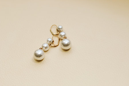 Gold ornaments from yellow metal on a light background.の写真素材