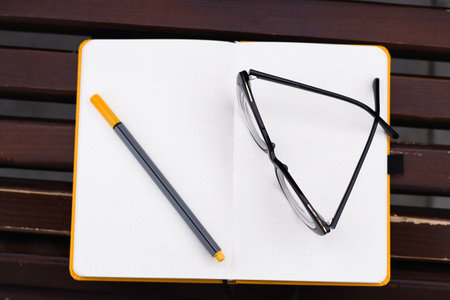 Glasses for vision on a notepad with a marker, study concept.の写真素材